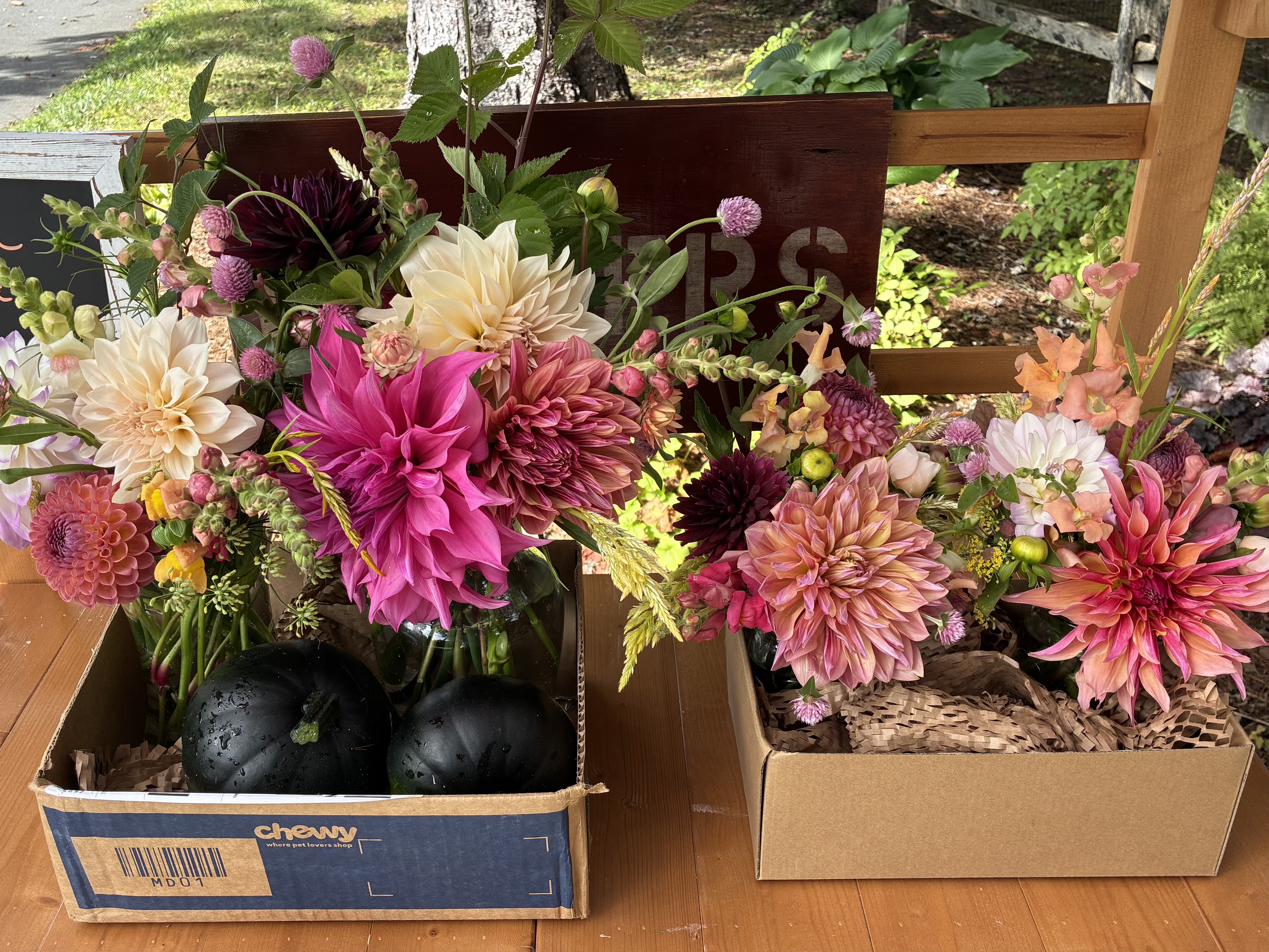 Buckets of fresh-cut flowers at the stand.