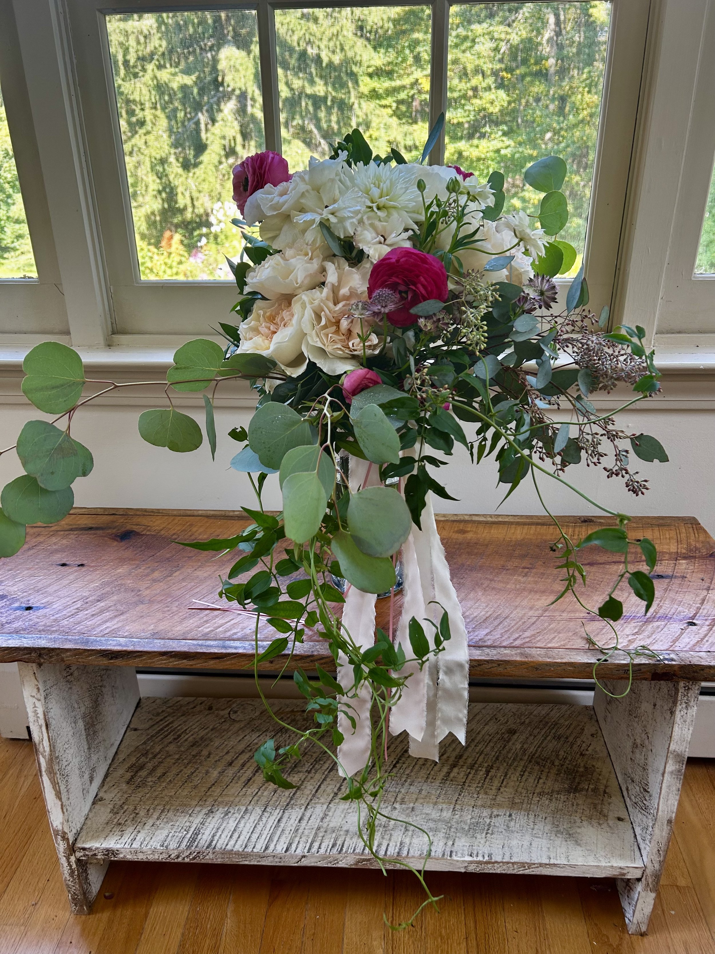 Custom bouquet with seasonal blooms.